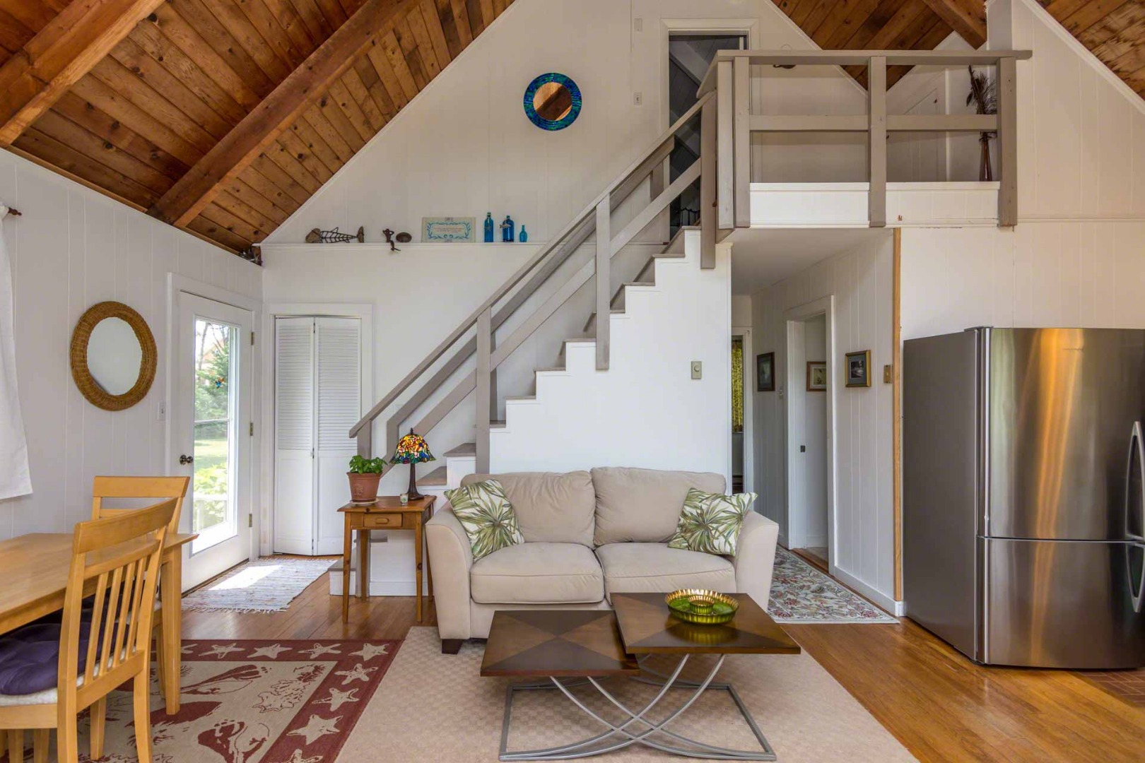 1 Garden Cove Road Edgartown, MA 02539 - Photo 28 of 37 a living room with couches chairs and closet with wooden floor