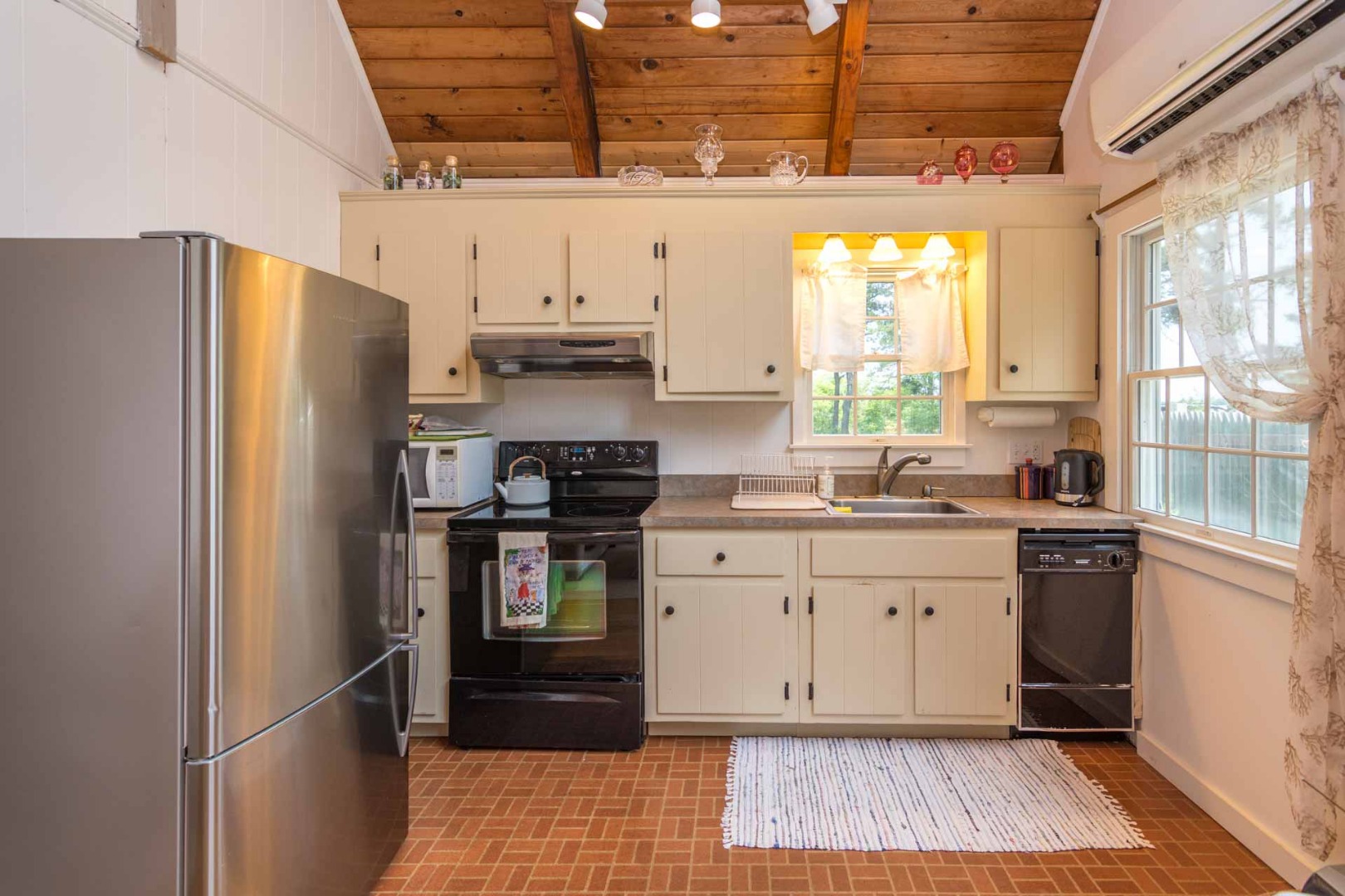 1 Garden Cove Road Edgartown, MA 02539 - Photo 31 of 37 a kitchen with stainless steel appliances granite countertop a refrigerator and a sink
