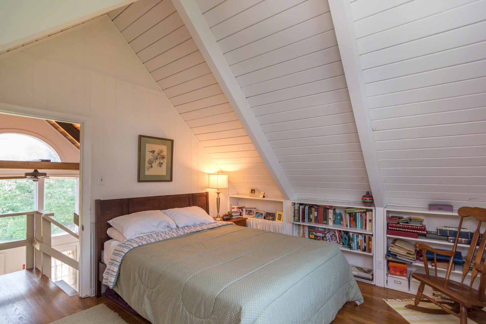 1 Garden Cove Road Edgartown, MA 02539 - Photo 33 of 37 a bedroom with a large bed and a book shelf