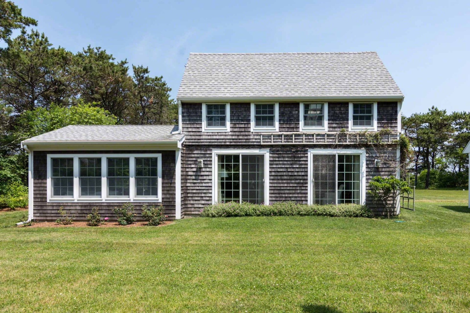 1 Garden Cove Road Edgartown, MA 02539 - Photo 4 of 37 front view of a house with a yard