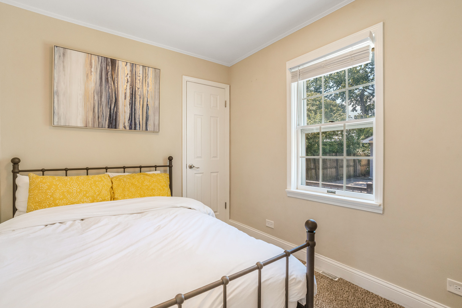 7510 Thomas Avenue Bridgeview, IL 60455 - Photo 11 of 25 a view of a bedroom with wooden floor and a window