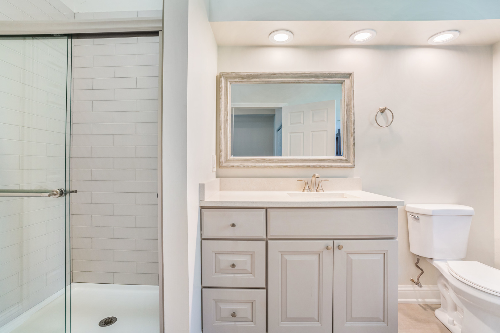 7510 Thomas Avenue Bridgeview, IL 60455 - Photo 15 of 25 a bathroom with a sink a toilet and shower