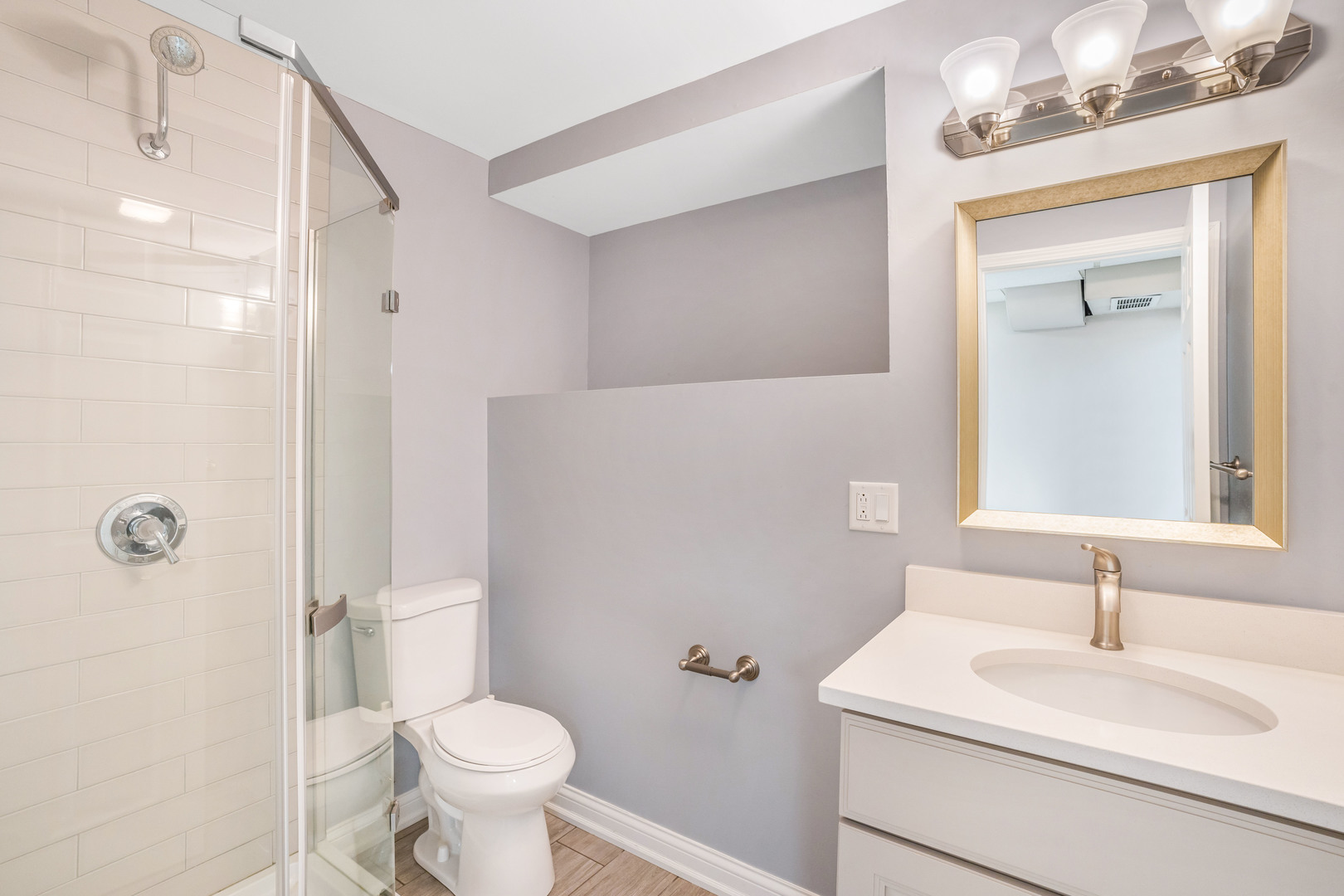 7510 Thomas Avenue Bridgeview, IL 60455 - Photo 17 of 25 a bathroom with a sink toilet vanity and shower