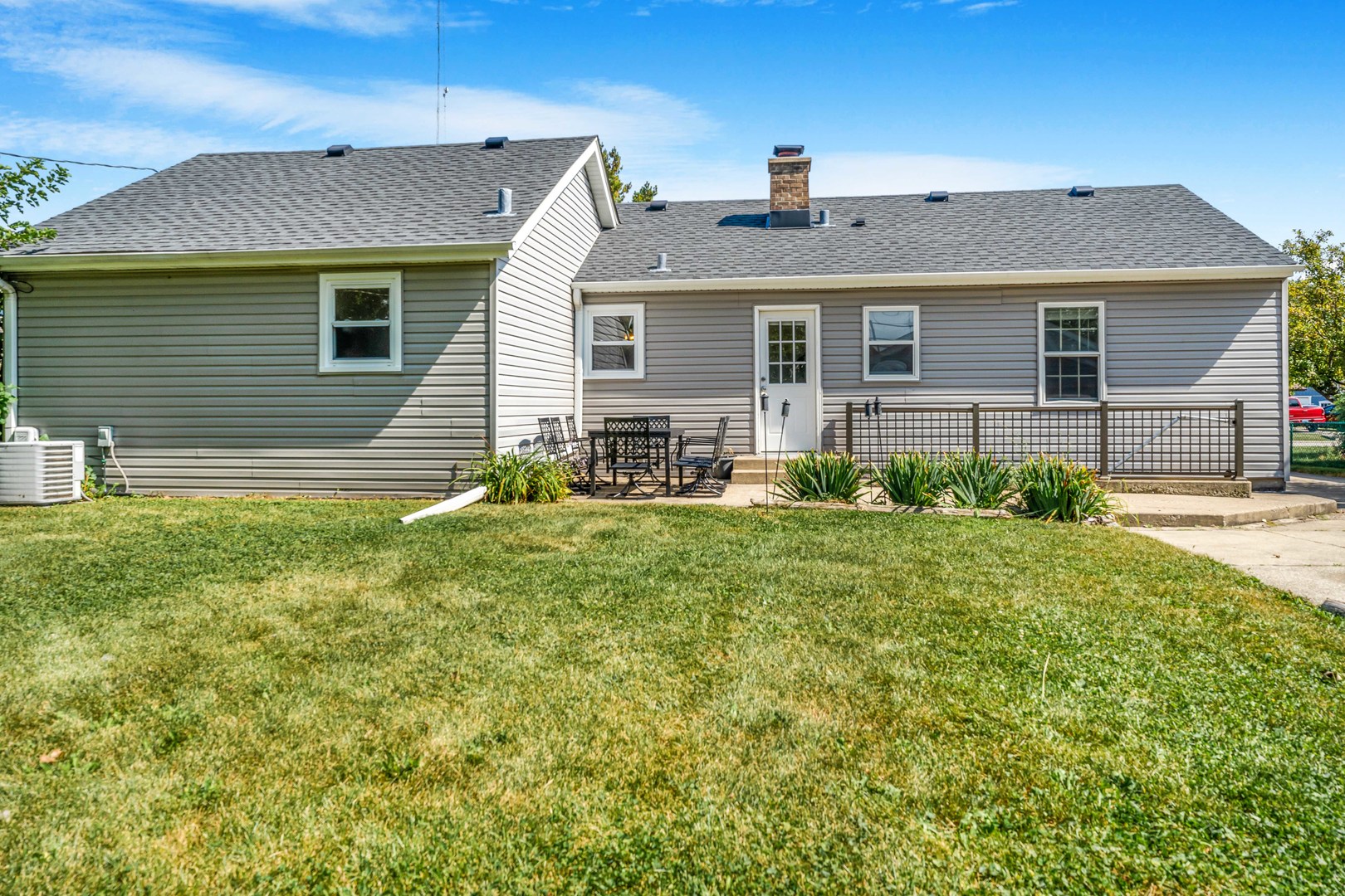 7510 Thomas Avenue Bridgeview, IL 60455 - Photo 20 of 25 a front view of house with yard and outdoor seating