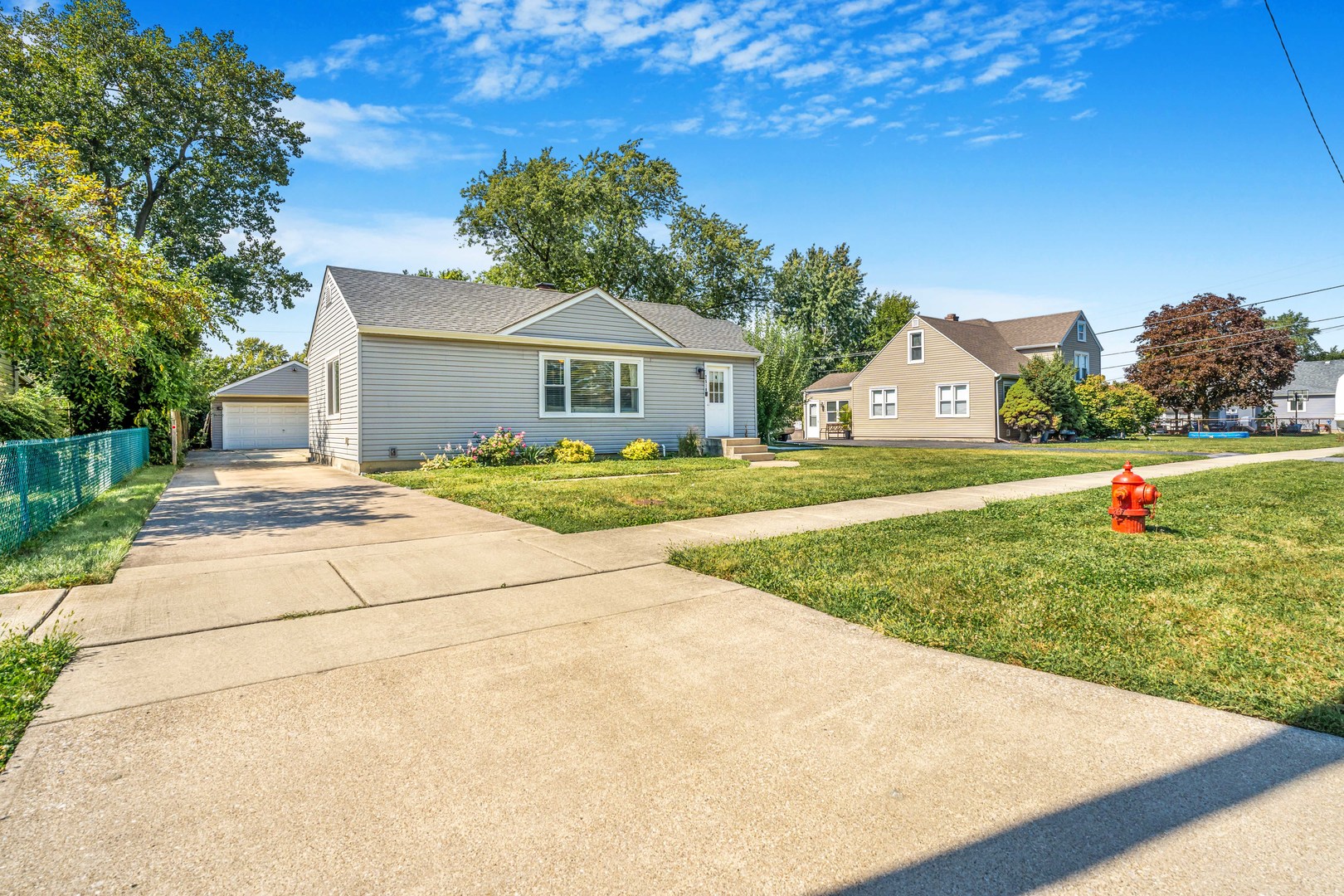 7510 Thomas Avenue Bridgeview, IL 60455 - Photo 2 of 25 a house with green field in front of it
