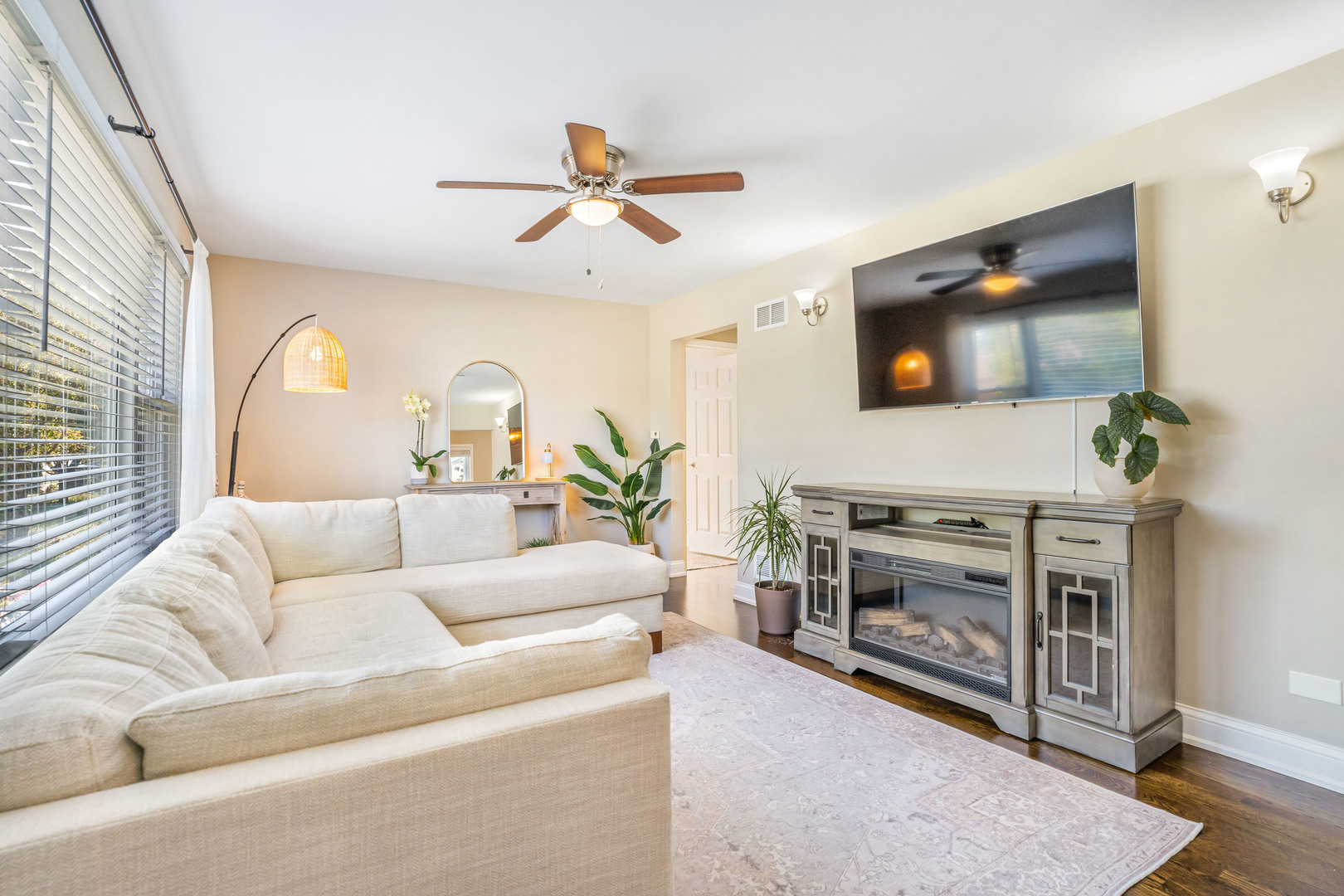 7510 Thomas Avenue Bridgeview, IL 60455 - Photo 5 of 25 a living room with furniture a flat screen tv and a fireplace