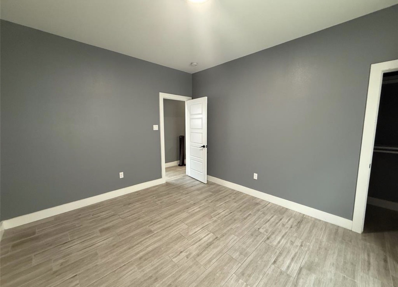 9815 Garcroft Street Houston, TX 77029 - Photo 8 of 14 a view of an empty room with wooden floor