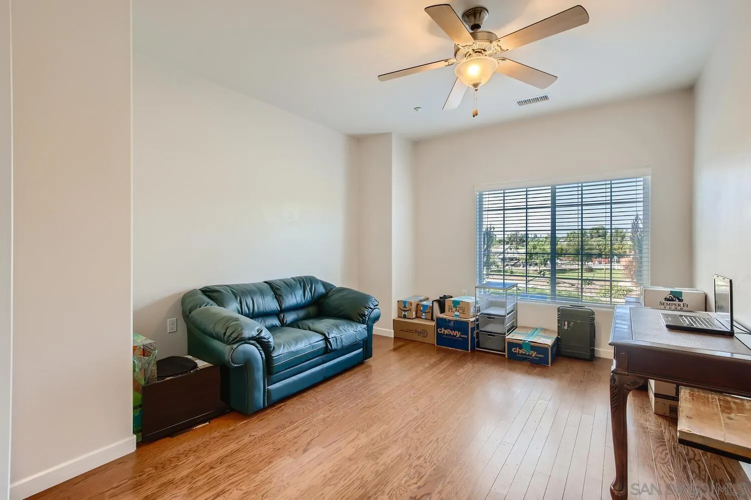 28553 Sunset Road Valley Center, CA 92082 - Photo 18 of 28 a living room with furniture and a wooden floor