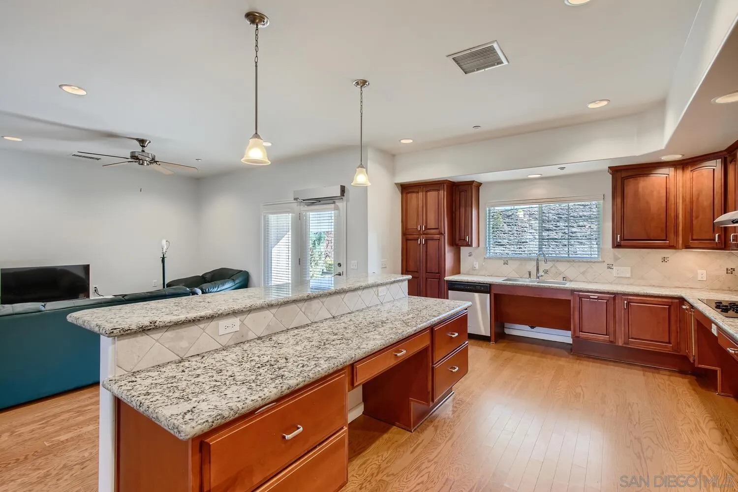 28553 Sunset Road Valley Center, CA 92082 - Photo 6 of 28 a kitchen with stainless steel appliances granite countertop a stove and a sink