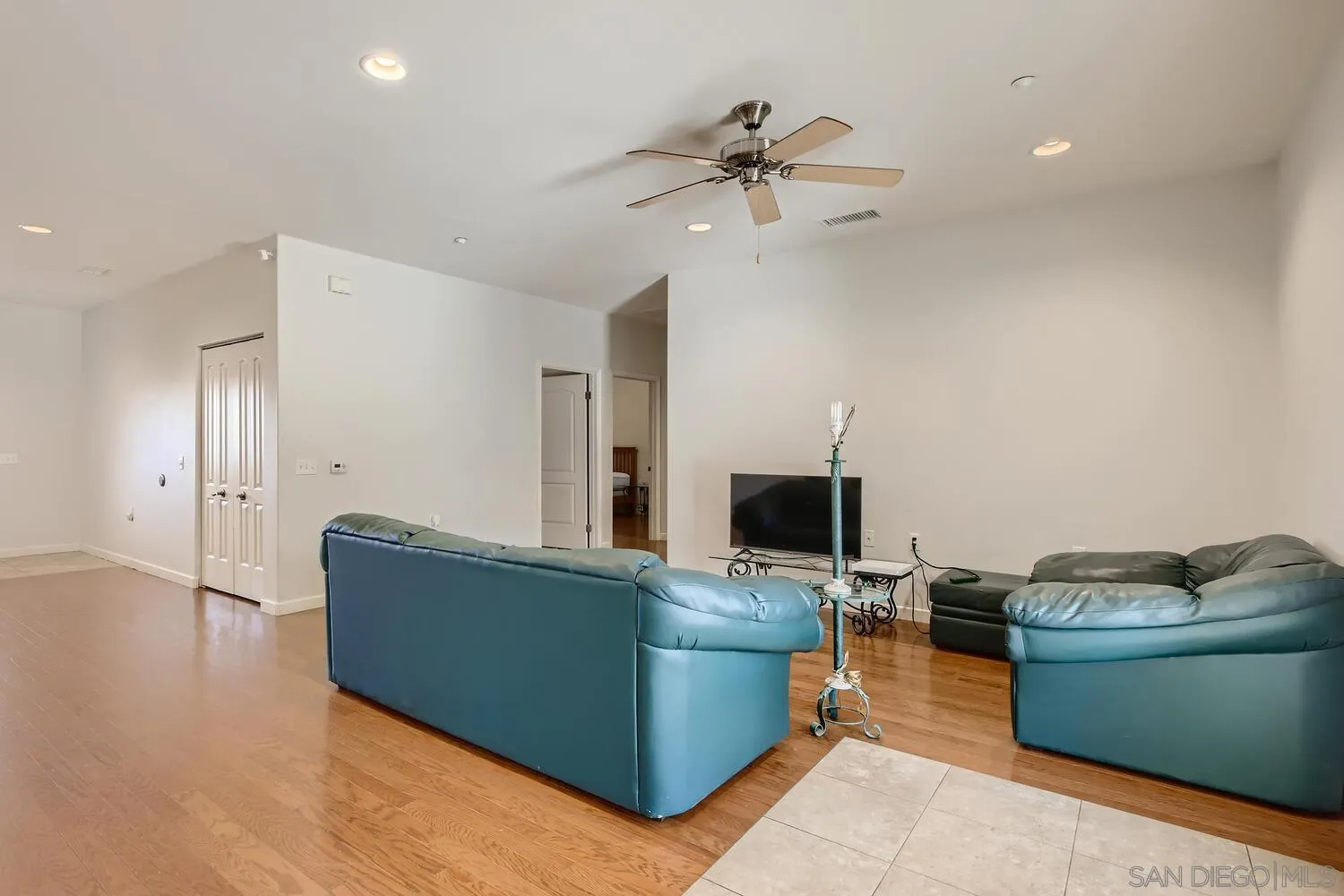 28553 Sunset Road Valley Center, CA 92082 - Photo 9 of 28 a living room with furniture and a flat screen tv