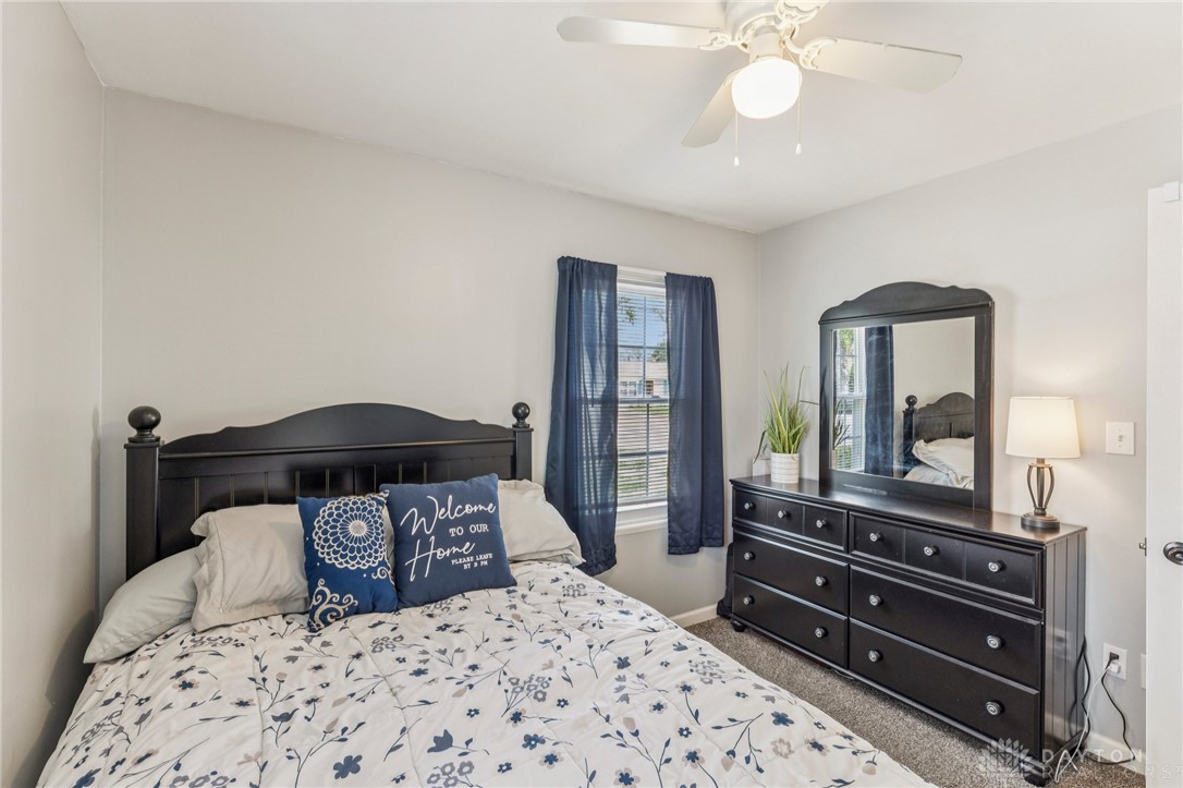 4934 Castleton Drive Fairfield, OH 45014 - Photo 17 of 36 This cozy bedroom features comfortable carpeting and a ceiling fan for optimal airflow.