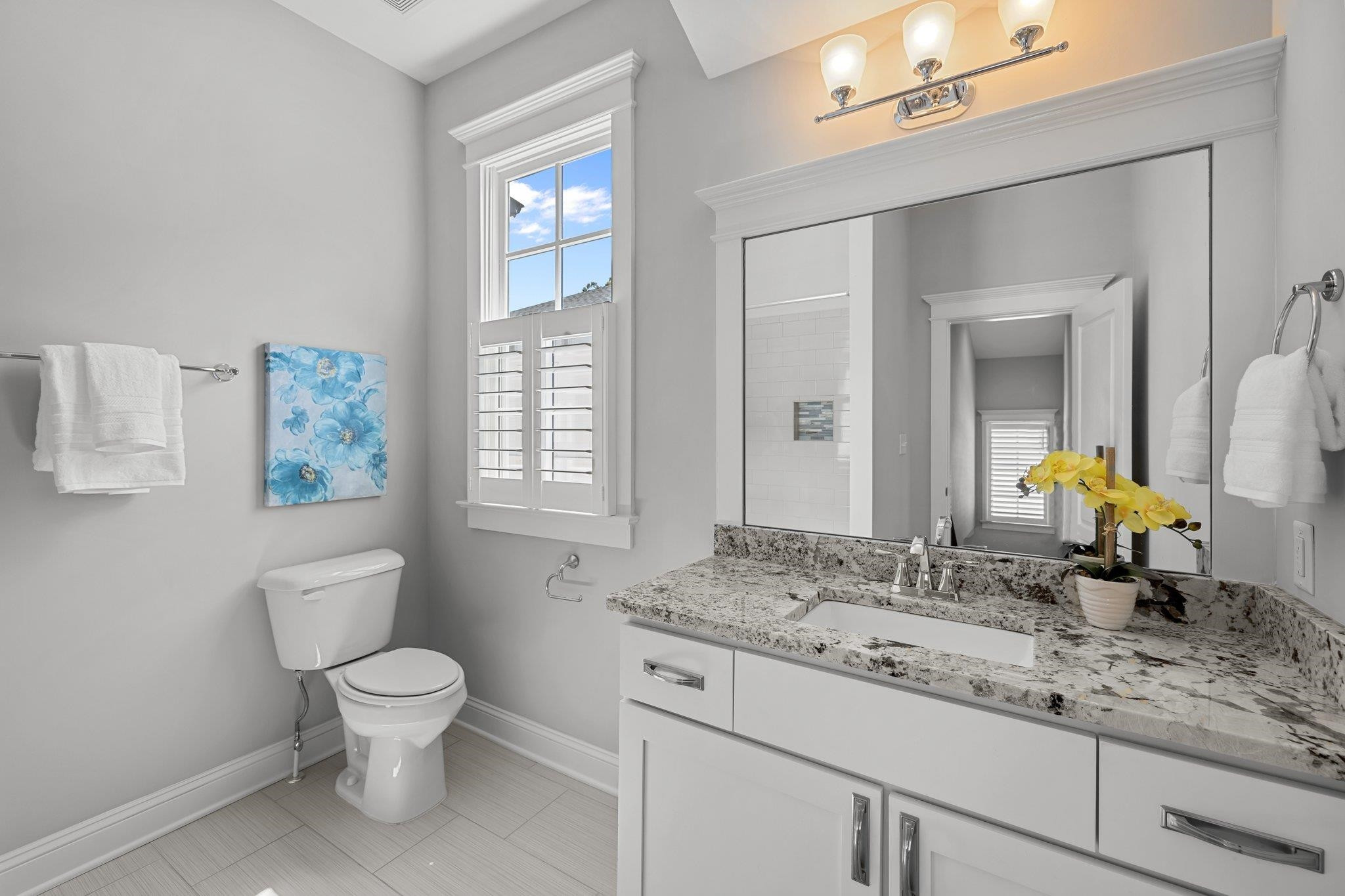2116 Cowper Drive Raleigh, NC 27608 - Photo 52 of 65 This is the updated full bathroom for the second and third bedrooms upstairs. Walk-in shower and a lofty ceiling set this one apart! Full Bath - Upstairs Hallway