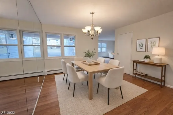 a view of a dining room with furniture window and wooden floor