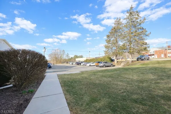 a view of a pathway both side of yard
