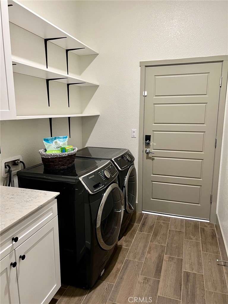 3751 Gabriel Drive Merced, CA 95340 - Photo 13 of 30 a utility room with sink dryer and washer
