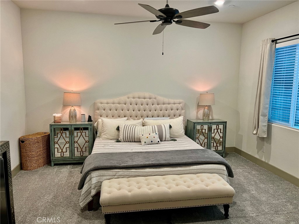 3751 Gabriel Drive Merced, CA 95340 - Photo 21 of 30 a bedroom with a bed and a chandelier