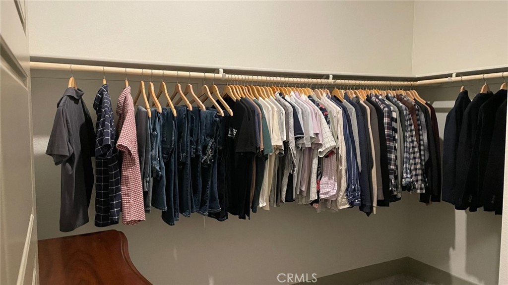 3751 Gabriel Drive Merced, CA 95340 - Photo 23 of 30 a view of walk in closet with clothes and shoes