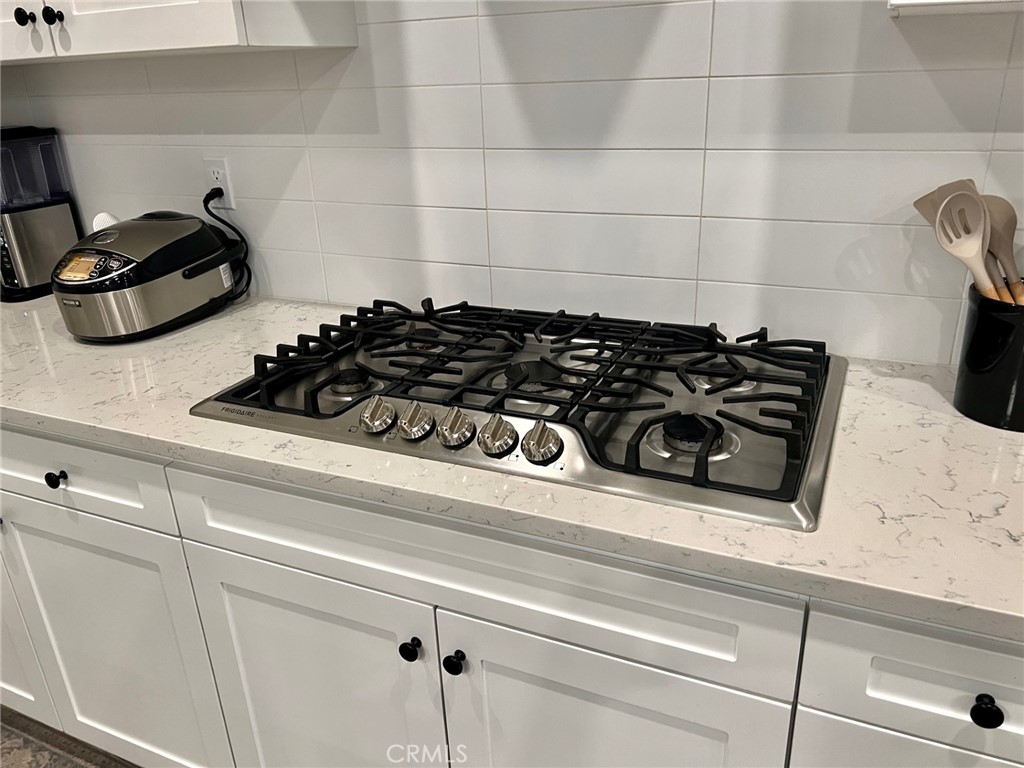 3751 Gabriel Drive Merced, CA 95340 - Photo 7 of 30 a close view of a stove top oven sitting inside of a kitchen