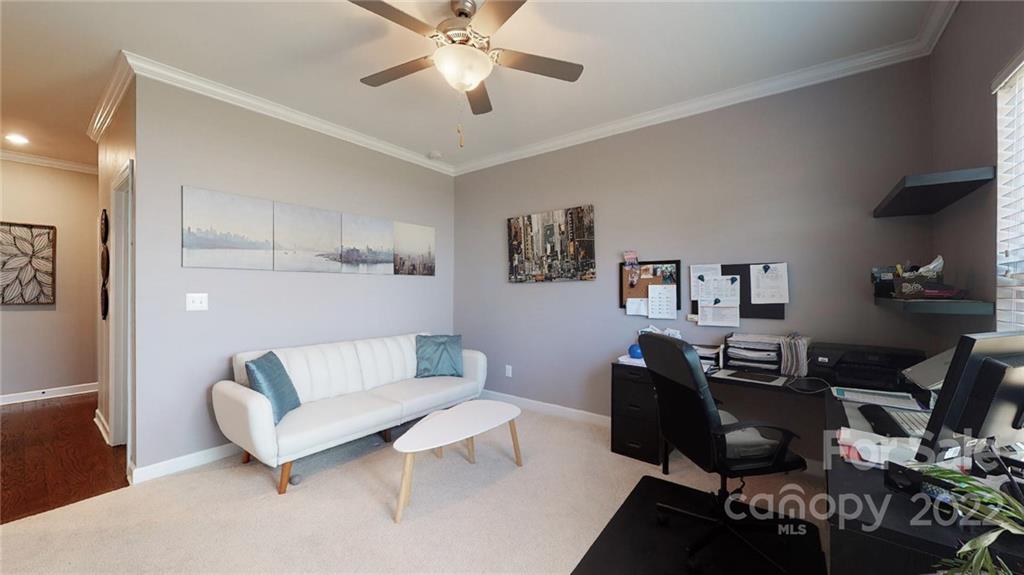 1137 Ellington Downs Way Monroe, NC 28110 - Photo 12 of 23 a living room with furniture and a flat screen tv