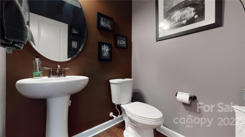1137 Ellington Downs Way Monroe, NC 28110 - Photo 13 of 23 a bathroom with a toilet sink and mirror