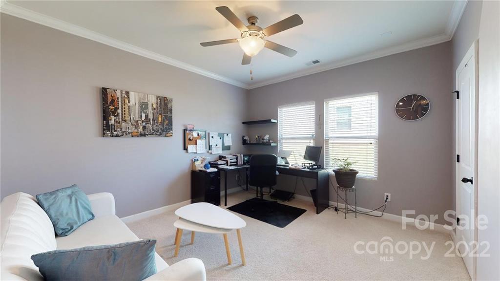 1137 Ellington Downs Way Monroe, NC 28110 - Photo 14 of 23 a living room with furniture and a large window