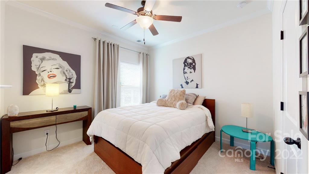 1137 Ellington Downs Way Monroe, NC 28110 - Photo 15 of 23 a bedroom with a bed and a dresser
