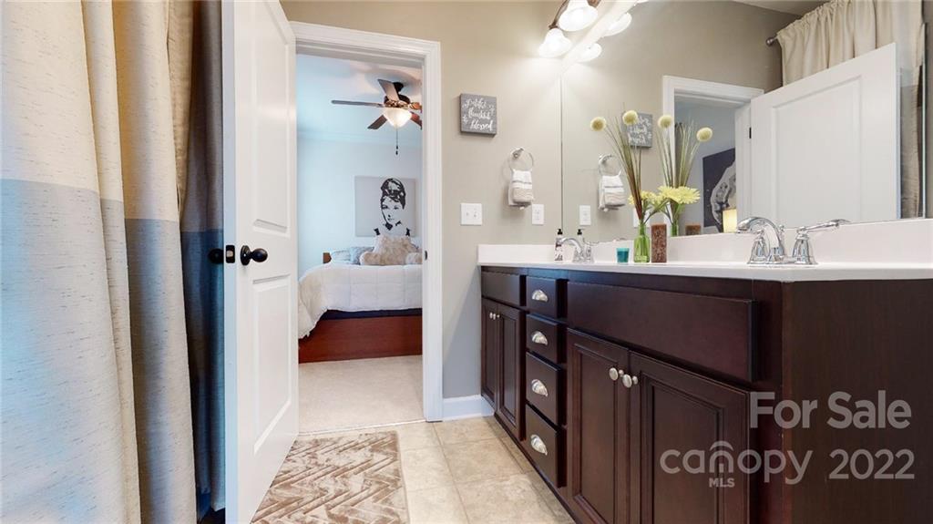 1137 Ellington Downs Way Monroe, NC 28110 - Photo 17 of 23 a en suite bathroom with a sink and a mirror