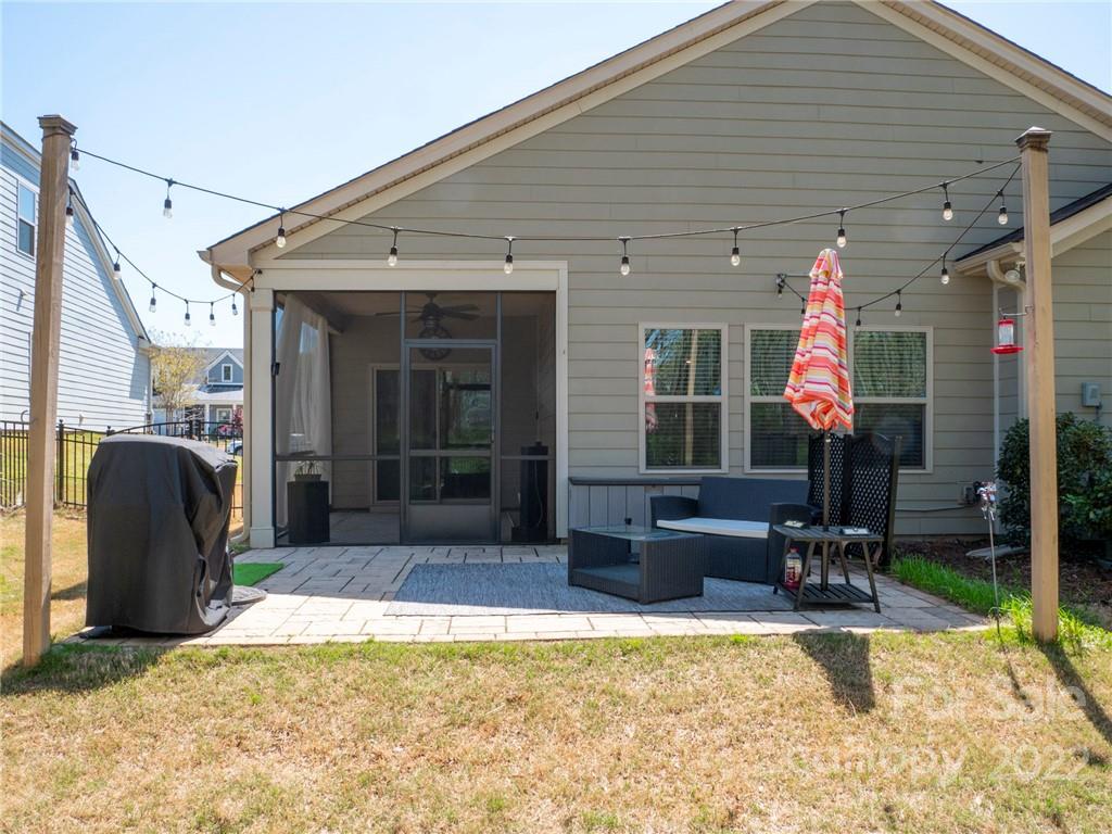 1137 Ellington Downs Way Monroe, NC 28110 - Photo 22 of 23 a front view of a house with patio