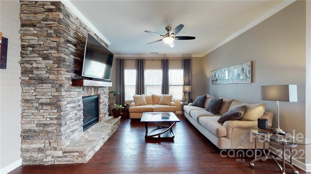 1137 Ellington Downs Way Monroe, NC 28110 - Photo 8 of 23 a living room with furniture and a fireplace