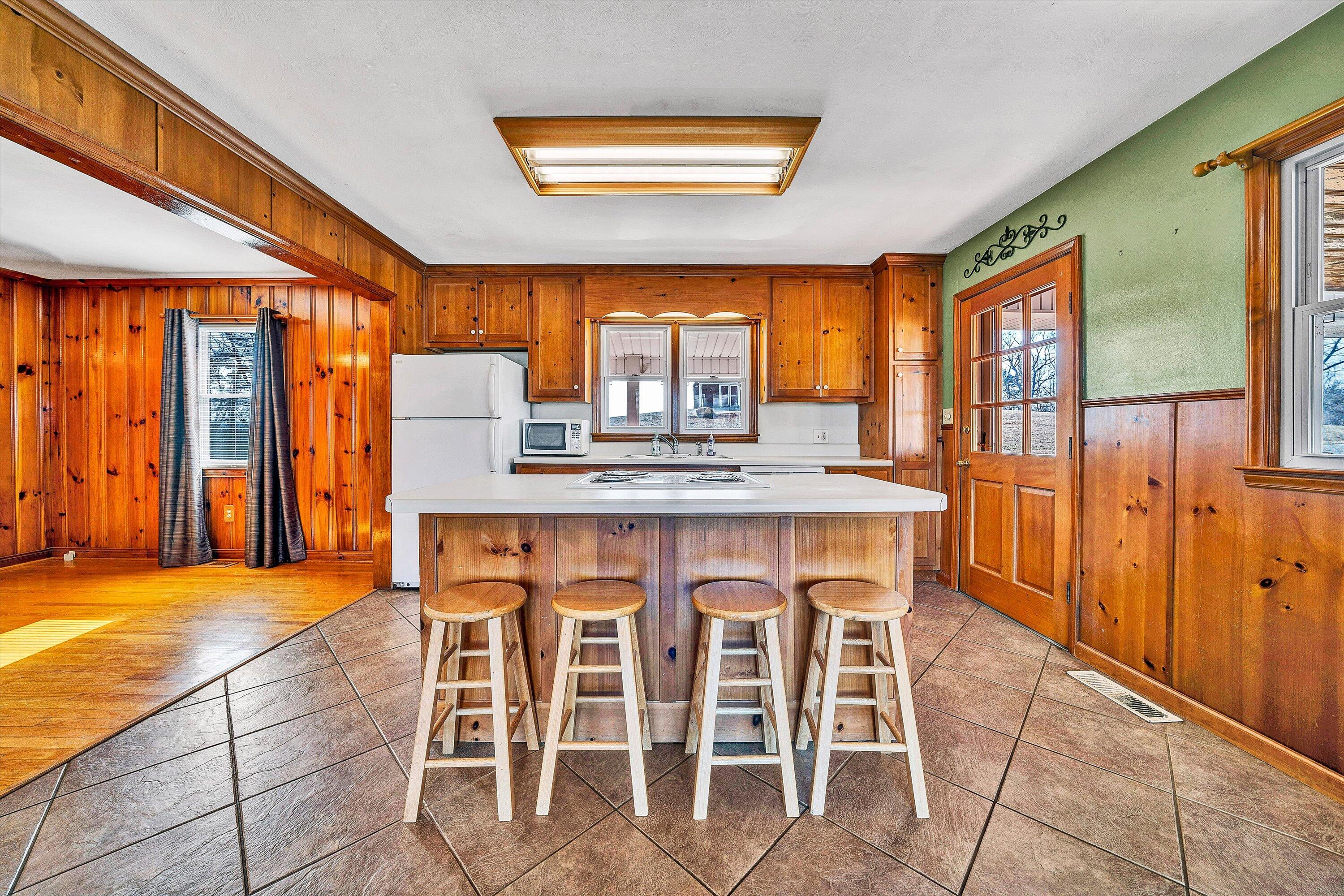 2483 Callaway Road Rocky Mount, VA 24151 - Photo 12 of 44 a dining room with a large window table and chairs
