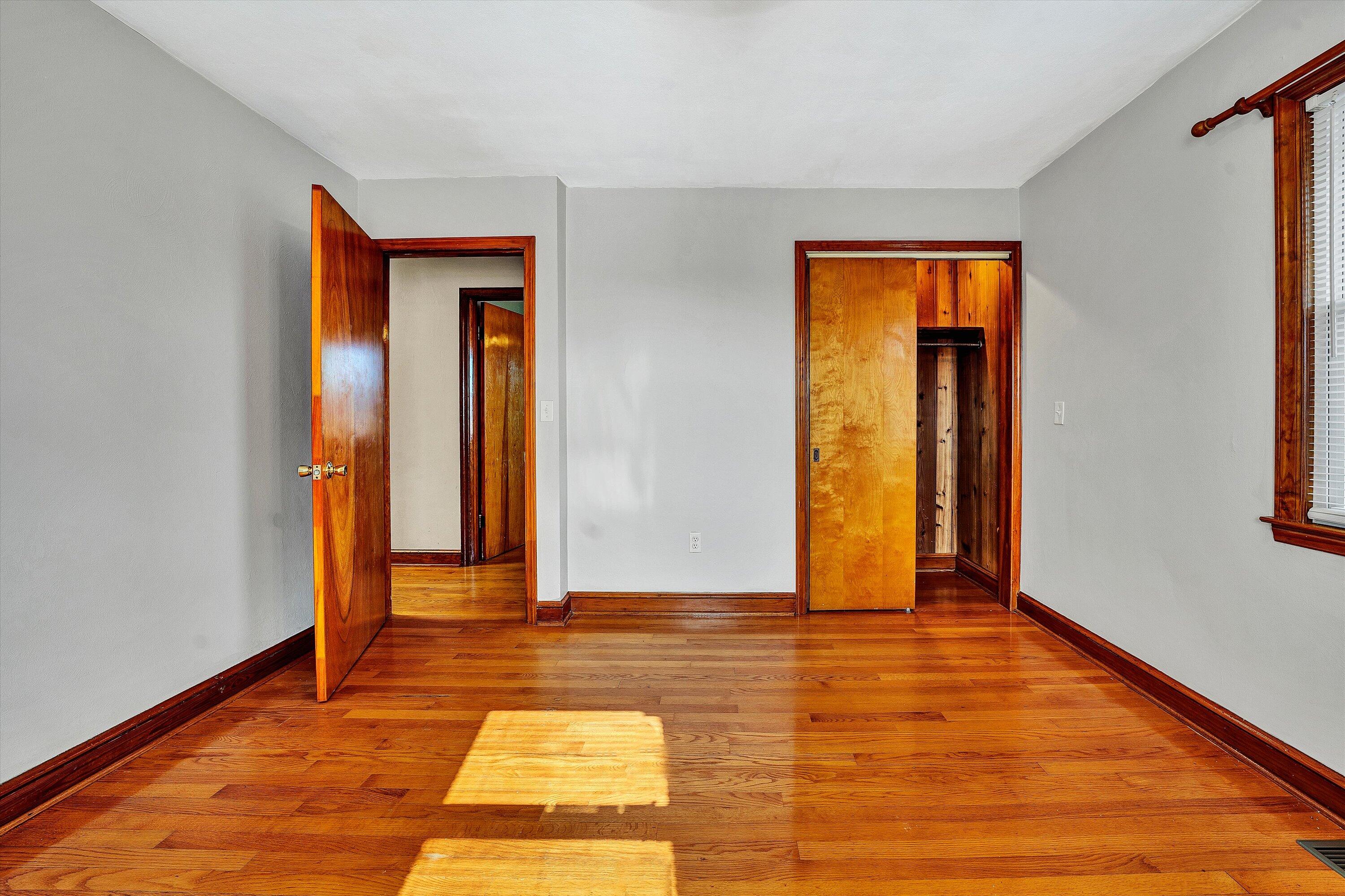 2483 Callaway Road Rocky Mount, VA 24151 - Photo 23 of 44 a view of an empty room with window and wooden floor