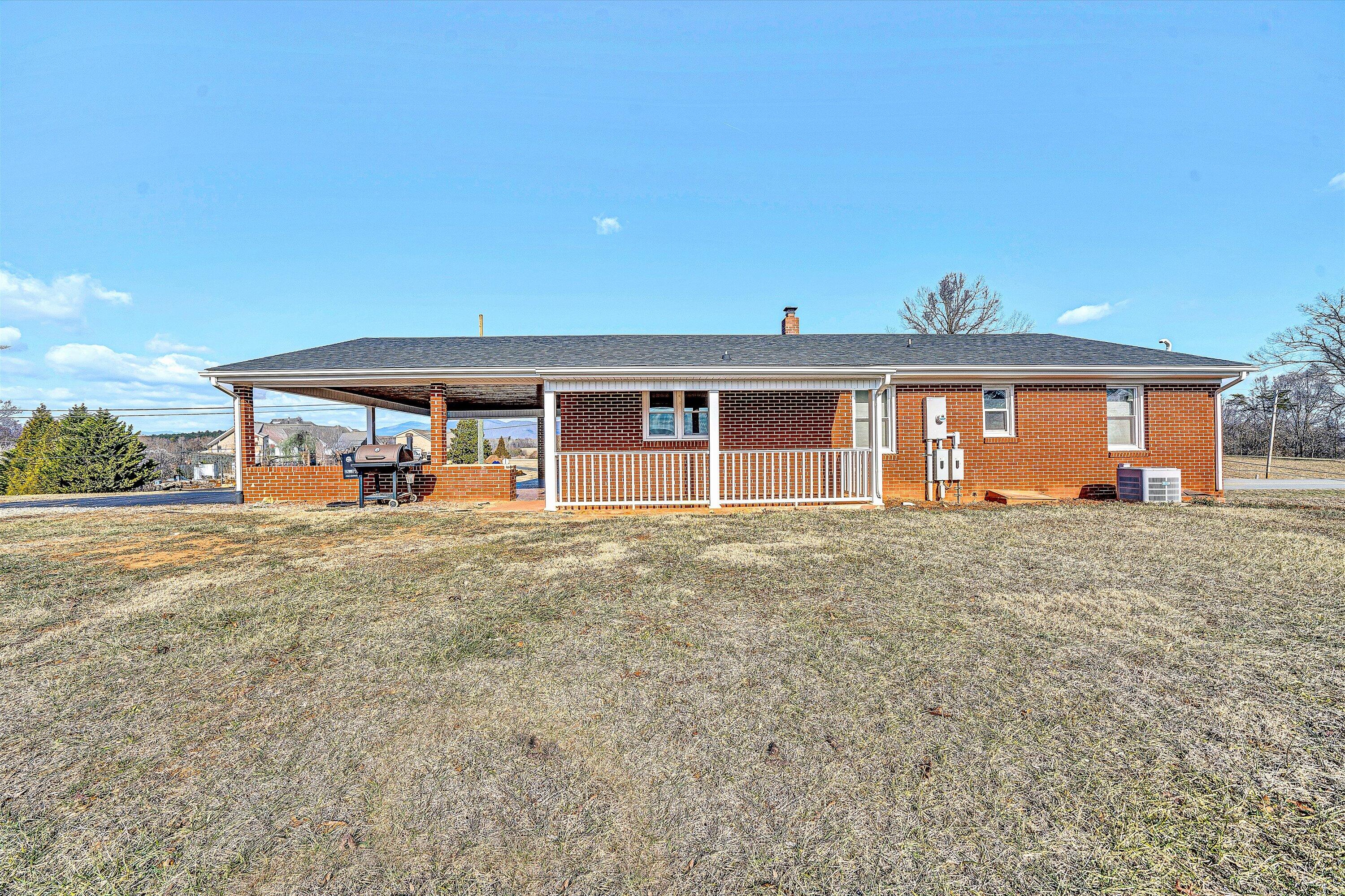 2483 Callaway Road Rocky Mount, VA 24151 - Photo 35 of 44 a view of a house with a backyard space and balcony