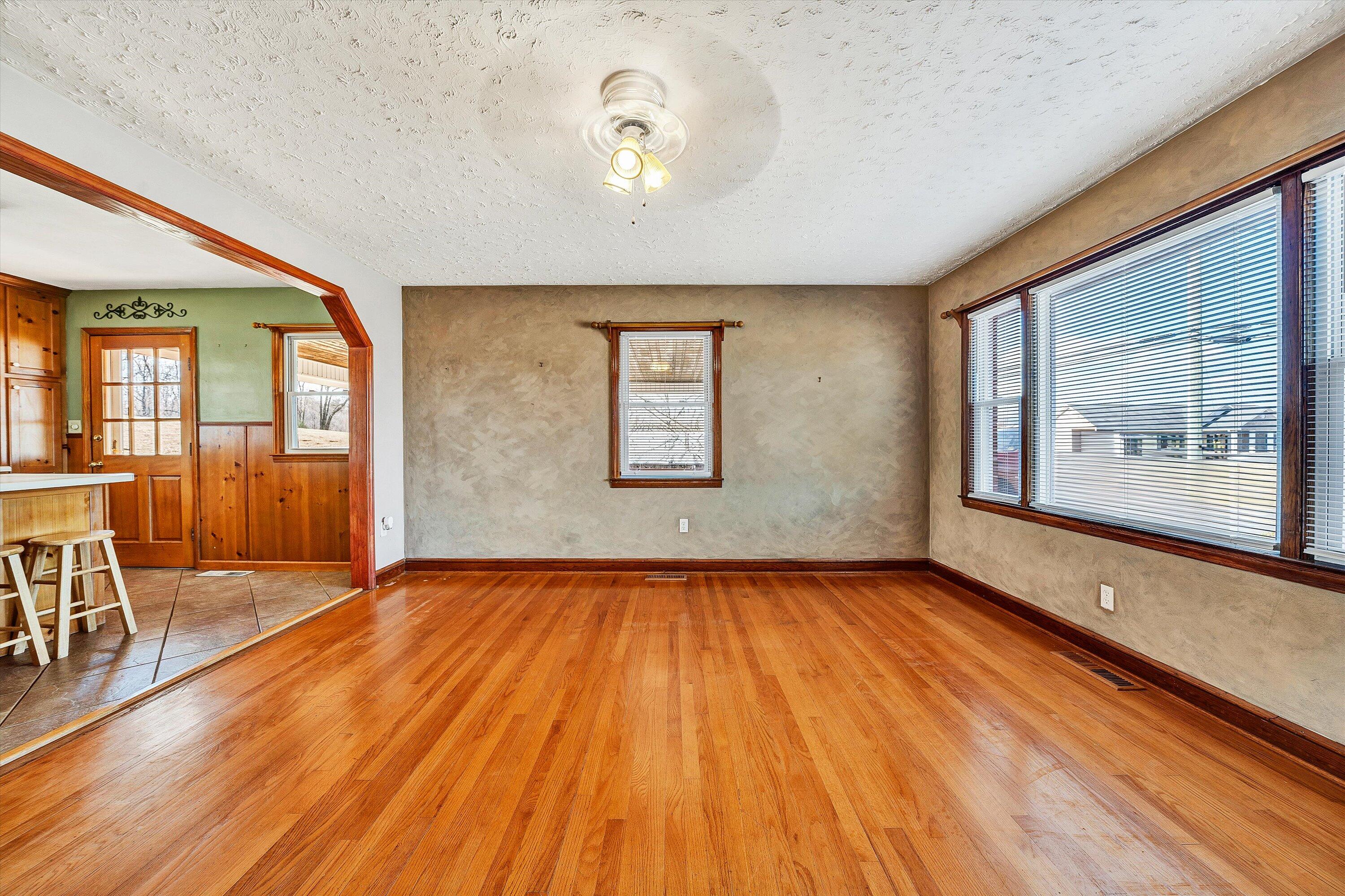 2483 Callaway Road Rocky Mount, VA 24151 - Photo 7 of 44 a view of an empty room with wooden floor and a window