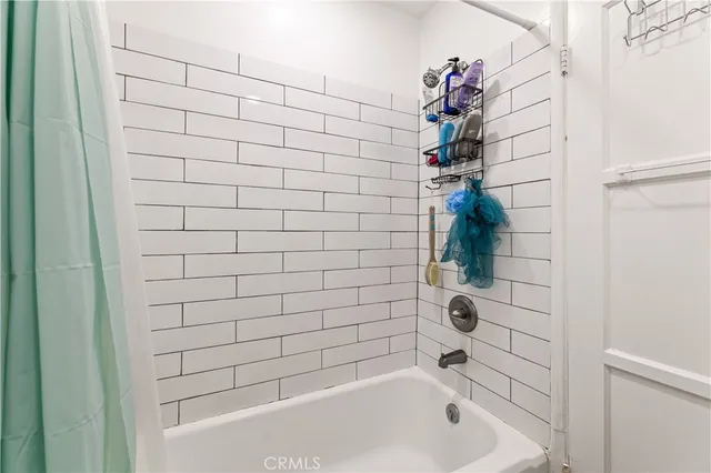 a view of a hallway with washer and dryer