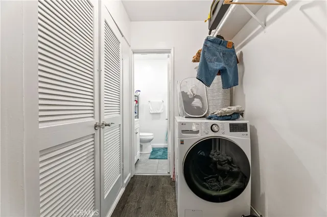 a kitchen with stainless steel appliances a white cabinets stove and a refrigerator