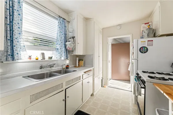a bathroom with a tub a sink and mirror