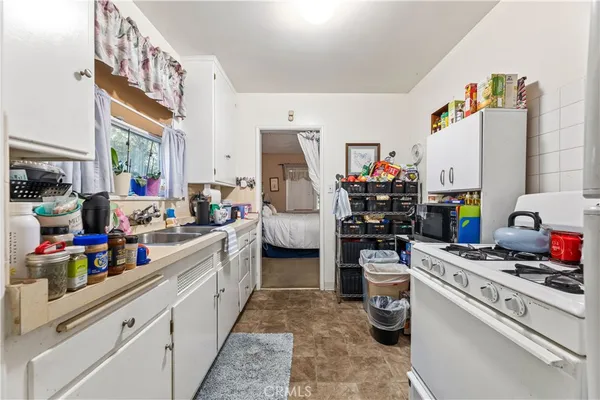 a view of a patio with table and chairs