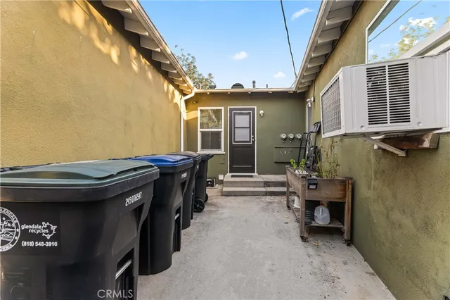 a view of a backyard with sitting area