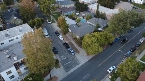 an aerial view of houses with outdoor space