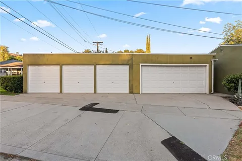 an aerial view of a residential houses with outdoor space