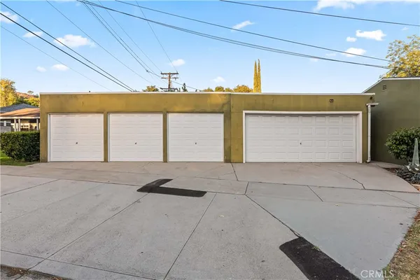 an aerial view of a residential houses with outdoor space