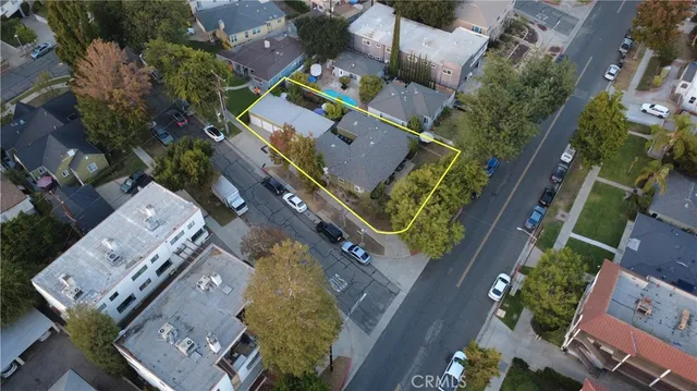an aerial view of house with a yard