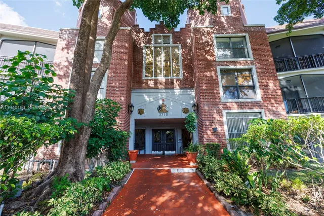 a living room with furniture fireplace and rug