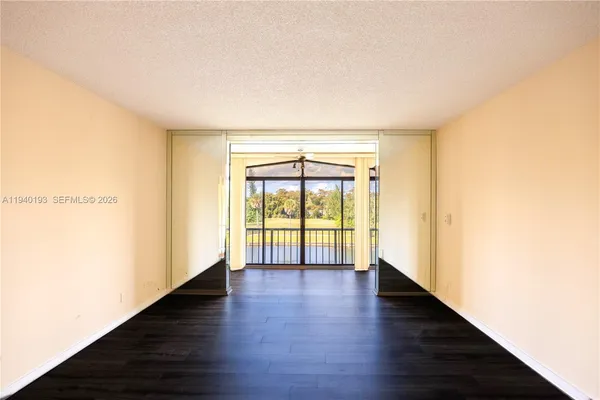 a view of a glass door and a window