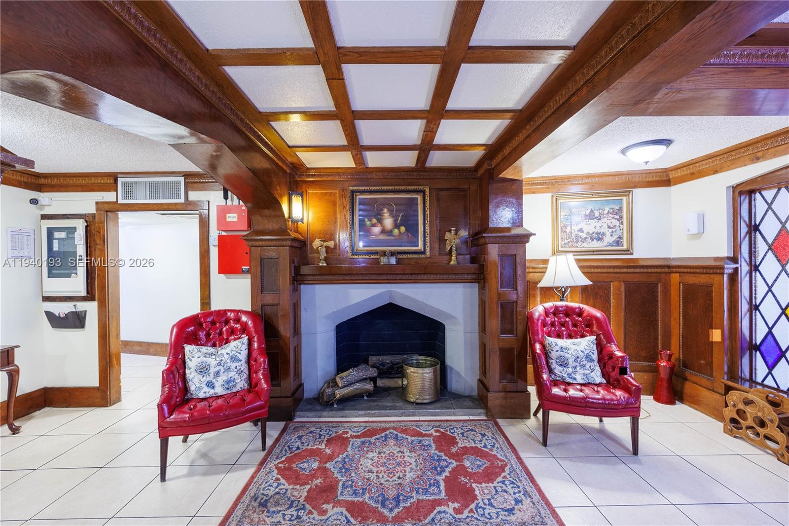 3760 Inverrary Drive, Unit 3D Lauderhill, FL 33319 - Photo 12 of 22 a living room with furniture fireplace and rug