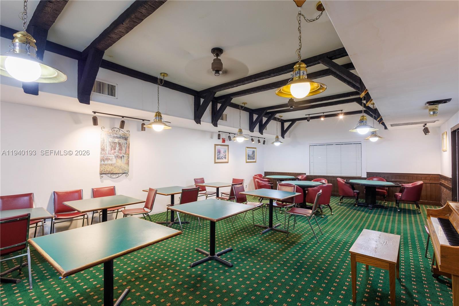 3760 Inverrary Drive, Unit 3D Lauderhill, FL 33319 - Photo 22 of 22 a living room with lots of furniture and a flat screen tv