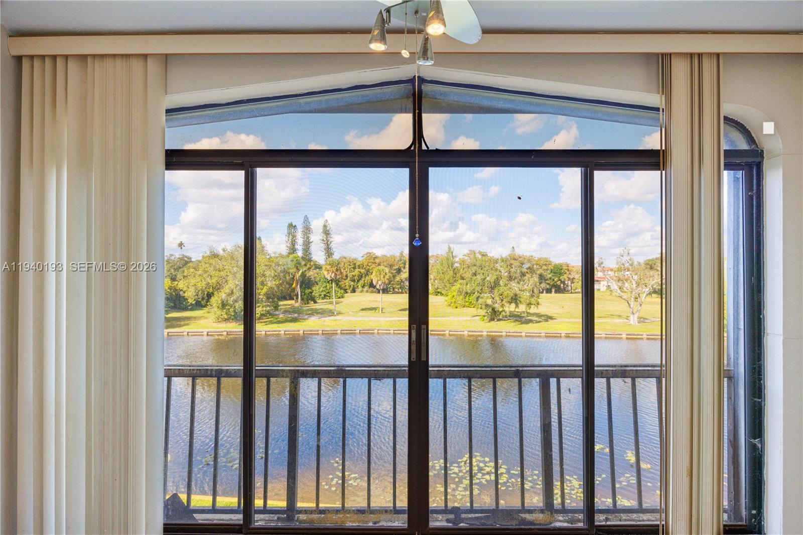 3760 Inverrary Drive, Unit 3D Lauderhill, FL 33319 - Photo 7 of 22 a view of a glass door with a from a window