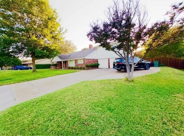 a view of a house with a yard porch and sitting area