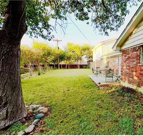 a backyard of a house with lots of green space