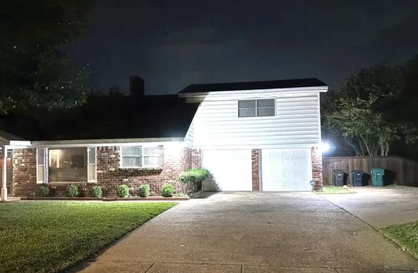 a back view of house and yard